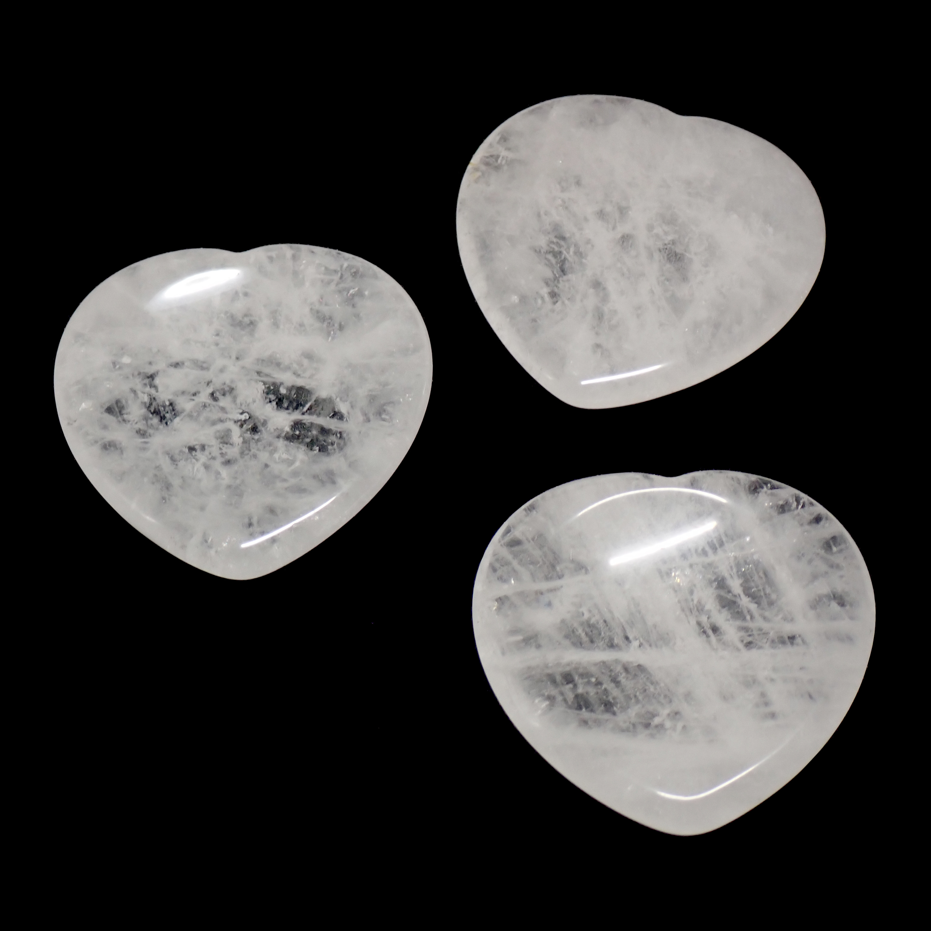 Photo de trois pierres pouce/worry stone en cristal de roche